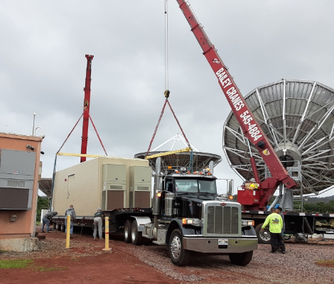 installing the satellite shelter with a crane