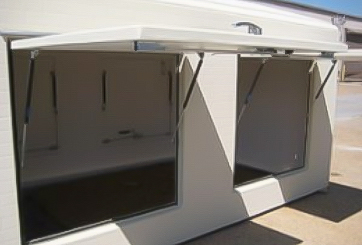 custom fiberglass shelter with top hinge access door