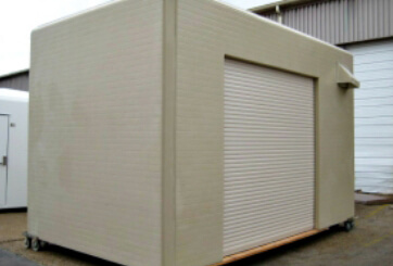 custom fiberglass shelter with roll-up door